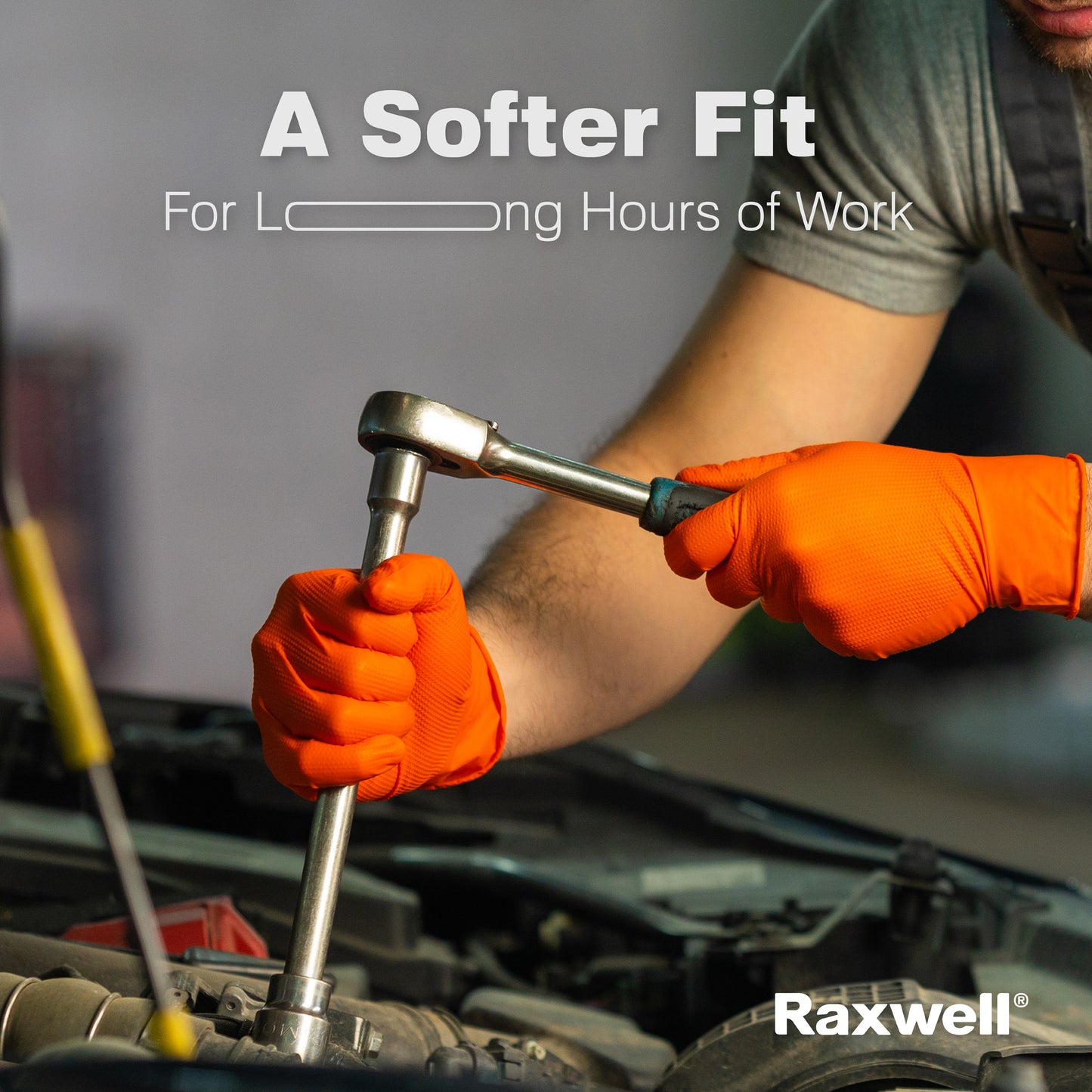 Mechanic wearing orange Raxwell gloves loosens a bolt under banner “A Softer Fit For Long Hours of Work.” Shows comfort during automotive tasks.